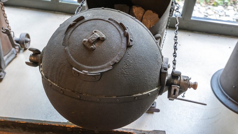 Picture of iron ball resembling the drum of a roaster