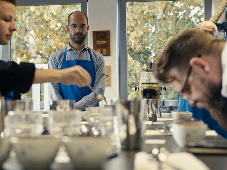 Industry Training The picture shows people during a coffee training in the Probat lab.